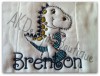 The example below is our #381 Doodle Font to spell
"Brenton" with our #588 Applique Dino the Dinosaur