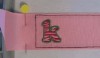 Picture of the stitched #520_SM_1RibbonTemp design with a "k" from our Zebra Filled Font as an example [no font is included in this set].