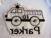 Before application - unprotected/covered stitches on the back of a t-shirt.
