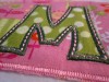 Picture of Sparse Satin Stitch template with the letter "M" from our #382 Funky Applique Font set [NOT included].